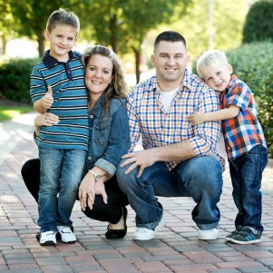 family posing for a portrait in the gardens outside of heinz field